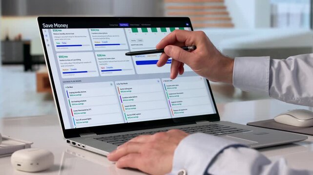 Man Uses Laptop To Track Personal Finance