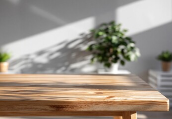Fototapeta premium Wooden Tabletop Surface with Sunlight Shadows and Green Houseplants in Background