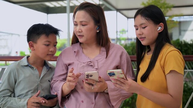 vibrant lifestyle photo of a modern family interacting with an artificial intelligence assistant on smartphone.