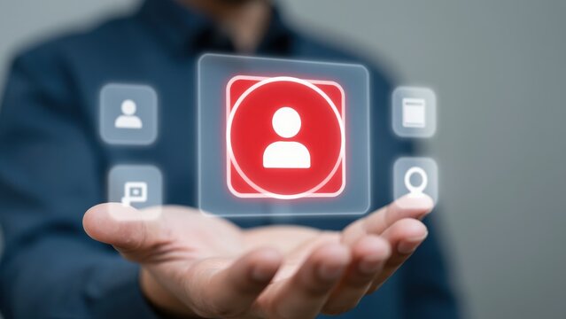 Digital User Interface: A person's hand tenderly cradles a glowing, transparent digital interface, encapsulating user icons, indicating the realm of virtual interaction and technological advancement.