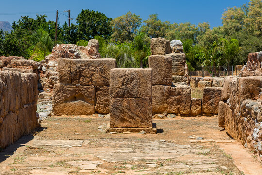 Weathered stone walls and blocks at the Minoan archaeological site in Malia