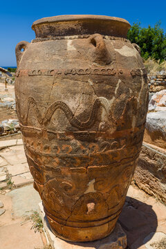 Large ancient Minoan pithos storage jar with ornate patterns at Malia Palace, Crete