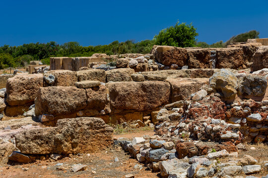 Ancient Minoan palace ruins featuring stone walls at the Malia site in Crete