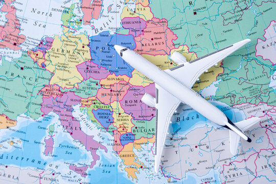 Airplane on Europe map representing international travel and global mobility