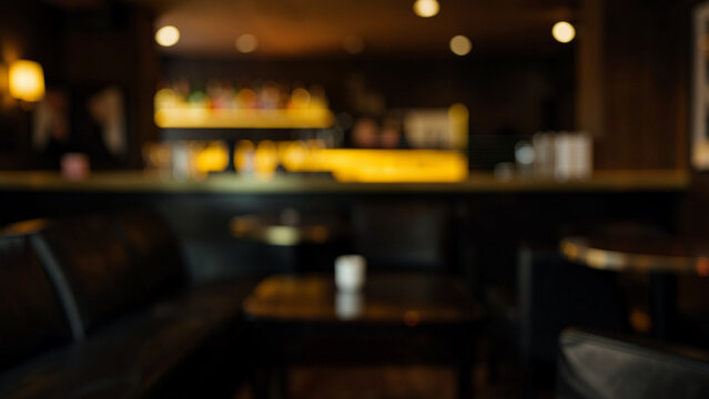 Upscale lounge bar interior with warm ambient lighting and comfortable seating
