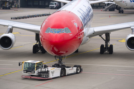 High angle view of Edelweiss Air passenger airplane type Airbus A340-300 registration HB-JME doing pushback Swiss Z&uuml;rich Airport on an autumn day. Photo taken October 9th, 2025, Zurich, Switzerland.