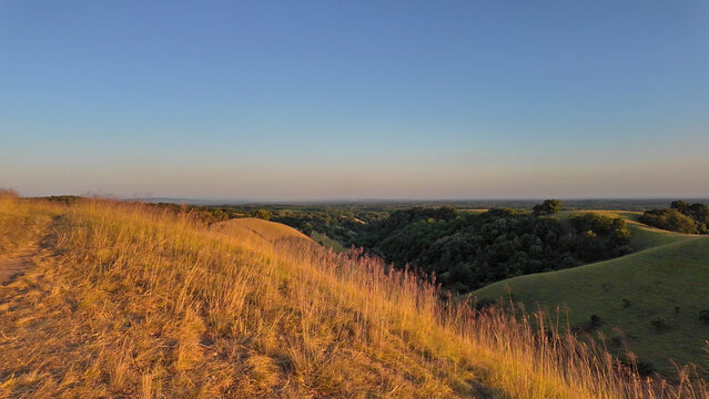 Tranquil sunny summer landscape with green fields and hills in south-eastern Europe, Serbia.