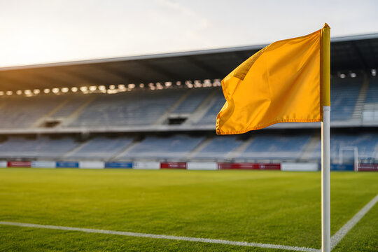 Yellow corner flag on empty soccer stadium pitch