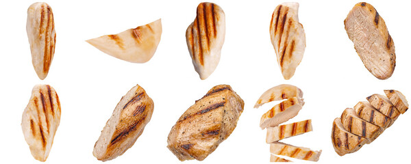 Collection of grilled chicken breast pieces, some whole and some sliced, isolated on a transparent background © Trangchuchue