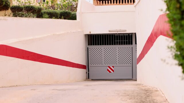 Closed automatic gate to the parking. 4K.