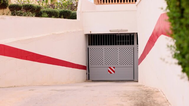 Closed automatic gate to the parking. 4K.