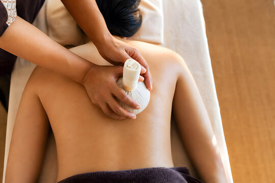 Thai Herbal Compress Massage On Relaxed Bare Back