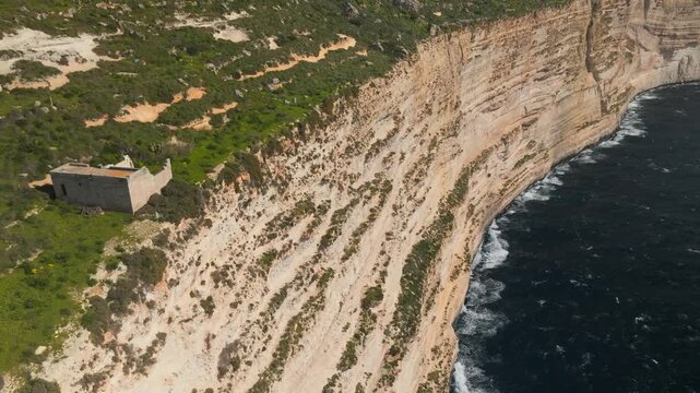 Aerial view of Dingli Cliffs with isolated ruins on the edge in Gozo, Malta