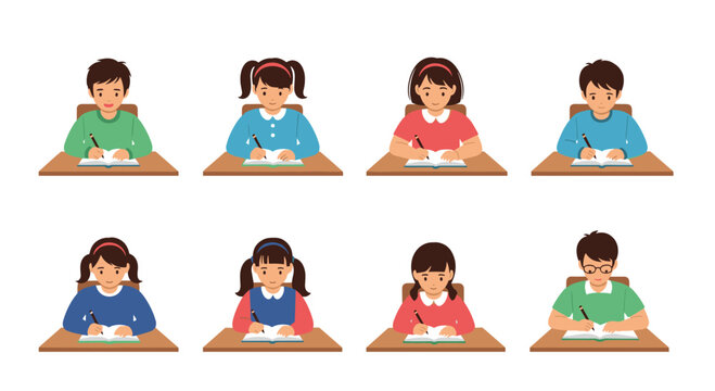 Group of young students sits at school desks and focuses on writing tasks in books during educational lesson in elementary classroom setting.