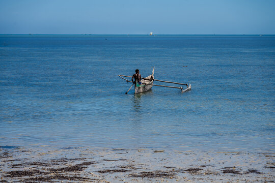 Traditional outrigger canoe on the turquoise waters near Ifaty