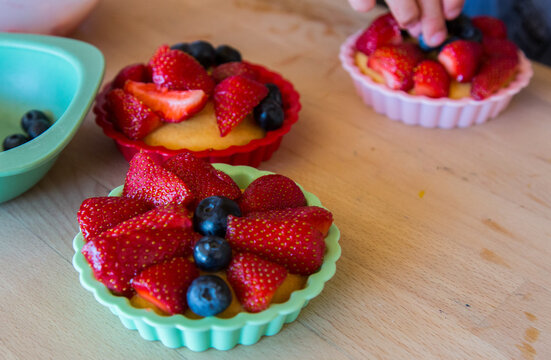 Small homemade berry tarts, cake with berries, close-up