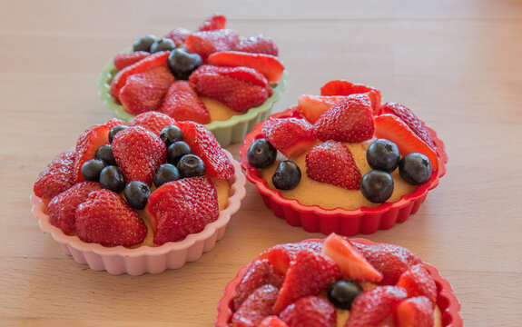 Small homemade berry tarts, cake with berries, close-up