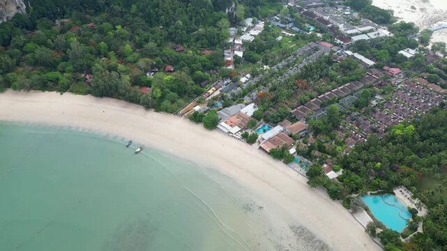 Krabi,  Thailand : Aerial drone footage of beach and waterfront resorts in Railay, Andaman coastline in Krabi, Thailand. Taken with downward motion