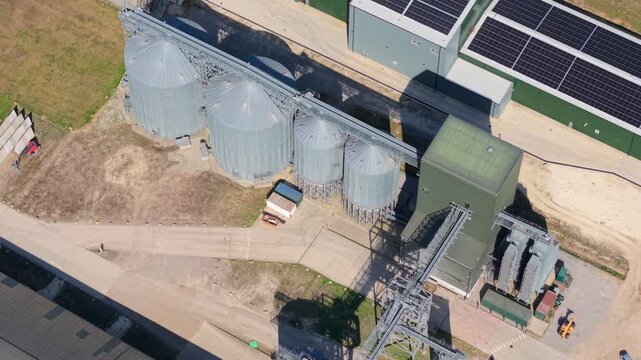Aerial view of Navara Oat Milling facility featuring large metal silos and industrial conveyor systems in Kettering, England, United Kingdom.
