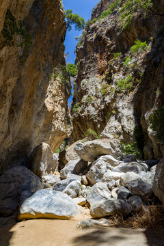 Hiking through the narrow and dramatic Sarakina Gorge on the island of Crete