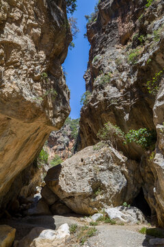 Massive rock walls and boulders in the Sarakina Gorge on the island of Crete, Greece