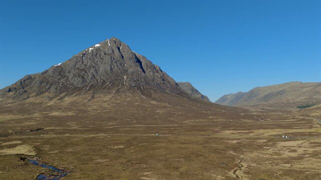 Aerial footage of Glencoe in the Highlands of Scotland. Drone shot looking up the glen towards Fort William. Stob Dearg, Buachille Etive Mor are visible in the foreground.