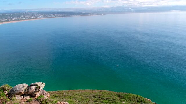 Kayak exploring vast calm ocean of Plettenberg Bay off Robberg Nature Reserve