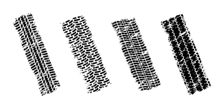 Collection of four distinct grunge tire tracks on a white background