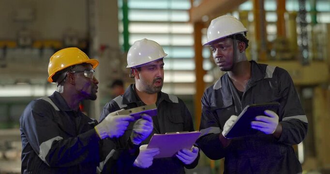 Factory technician inspecting auto parts, metal rod at machining station