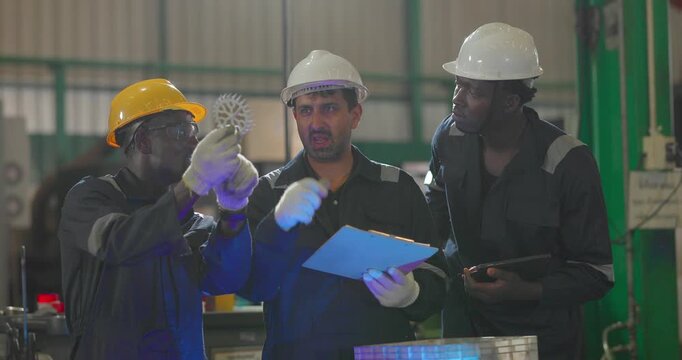 Factory technician inspecting auto parts, metal rod at machining station
