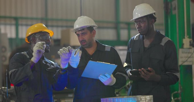 Factory technician inspecting auto parts, metal rod at machining station
