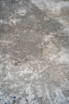 Close-up view of textured gray concrete surface with subtle variations.