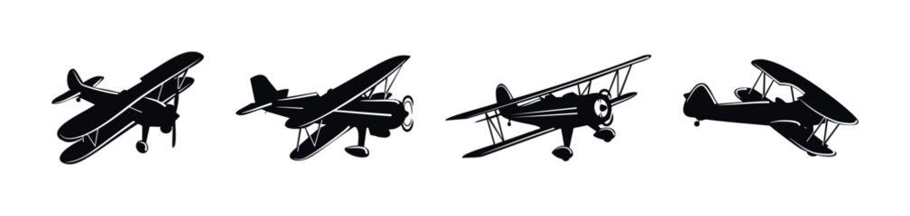 Collection of vintage biplane silhouettes in flight against a white background © 11ua