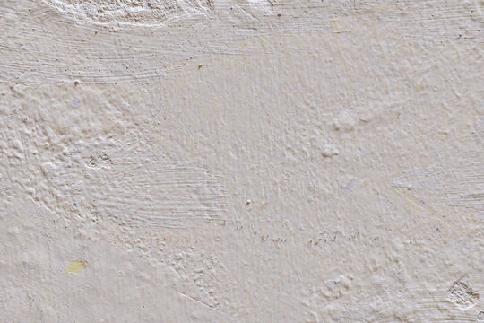 Textured white wall with subtle patterns and scratches.