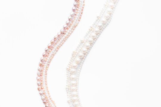 Precious pearls necklace beads for jewelry, top view. Different shapes pearls. Beauty and elegance concept background