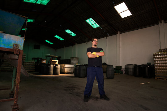 Real worker posing in warehouse