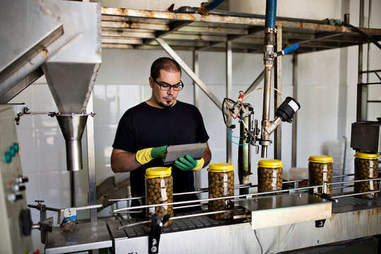 Man working at olives factory