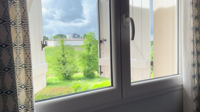 Scenic View of Saint Emilion Vineyards from an Open Window