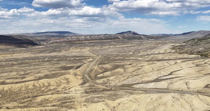 Aerial of Highway 191 in northeast Utah in high desert dry terrain in spring