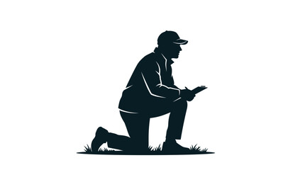 Silhouette of a person kneeling down looking at the ground. © Niswatul Kharimah