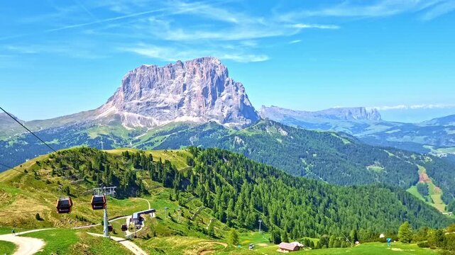 Dantercepies cable car and the rocky Sassolungo Mountain in Val Gardena, Dolomites, Italy