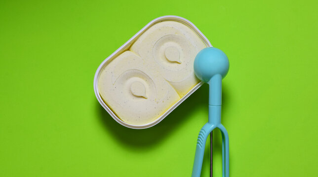 Vanilla ice cream, zenith view and copy space. Green background.	