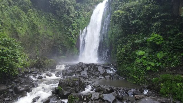 Aerial Drone Footage of Gomblang Waterfall in Dense Tropical Forest, Java Indonesia
