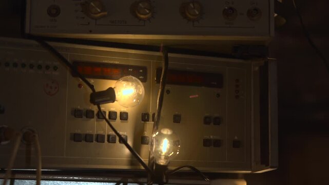 Antique Laboratory Or Repair Station Showcasing Classic Electronic Apparatus And Glowing Lamps . Media