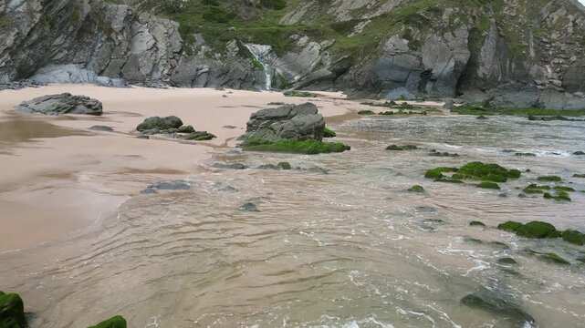 Aerial drone footage of Praia da Am&aacute;lia, Portugal: hidden beach, rugged cliffs and wild Atlantic coastline under natural light. Ideal for travel, nature and summer projects.