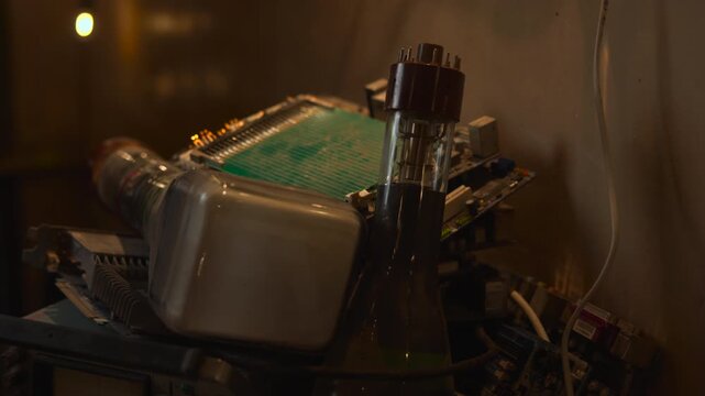 Vintage Oscilloscope Scene. Oldfashioned Oscilloscope Displaying Glass Envelope Illuminated By Warm Lights . Media