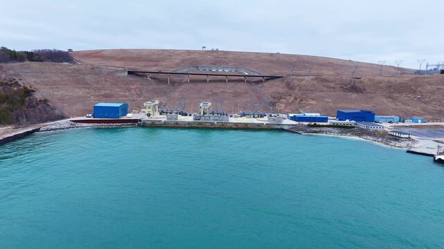 Hydroelectric facility utilizing water reservoirs for electricity generation, showcasing sustainable energy