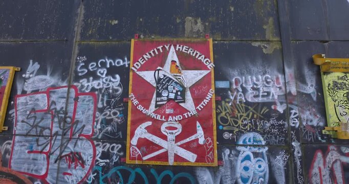 various artwork and grafitti on display on the Peace Wall in Belfast