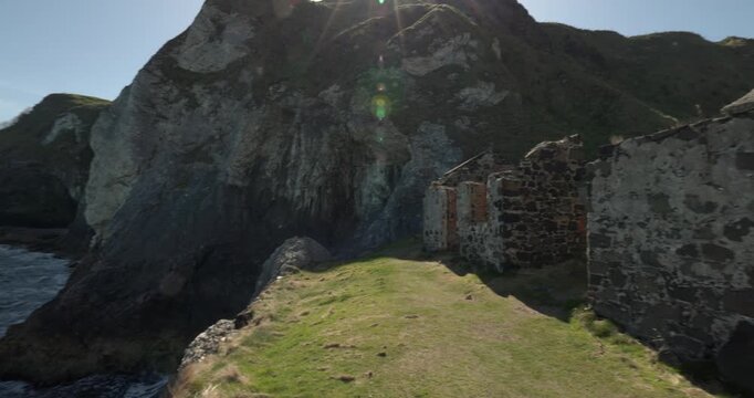 builkding remains alonside a coastal cliff beside Kinbane Castle