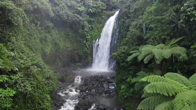 Aerial Drone Footage of Gomblang Waterfall in Dense Tropical Forest, Java Indonesia
